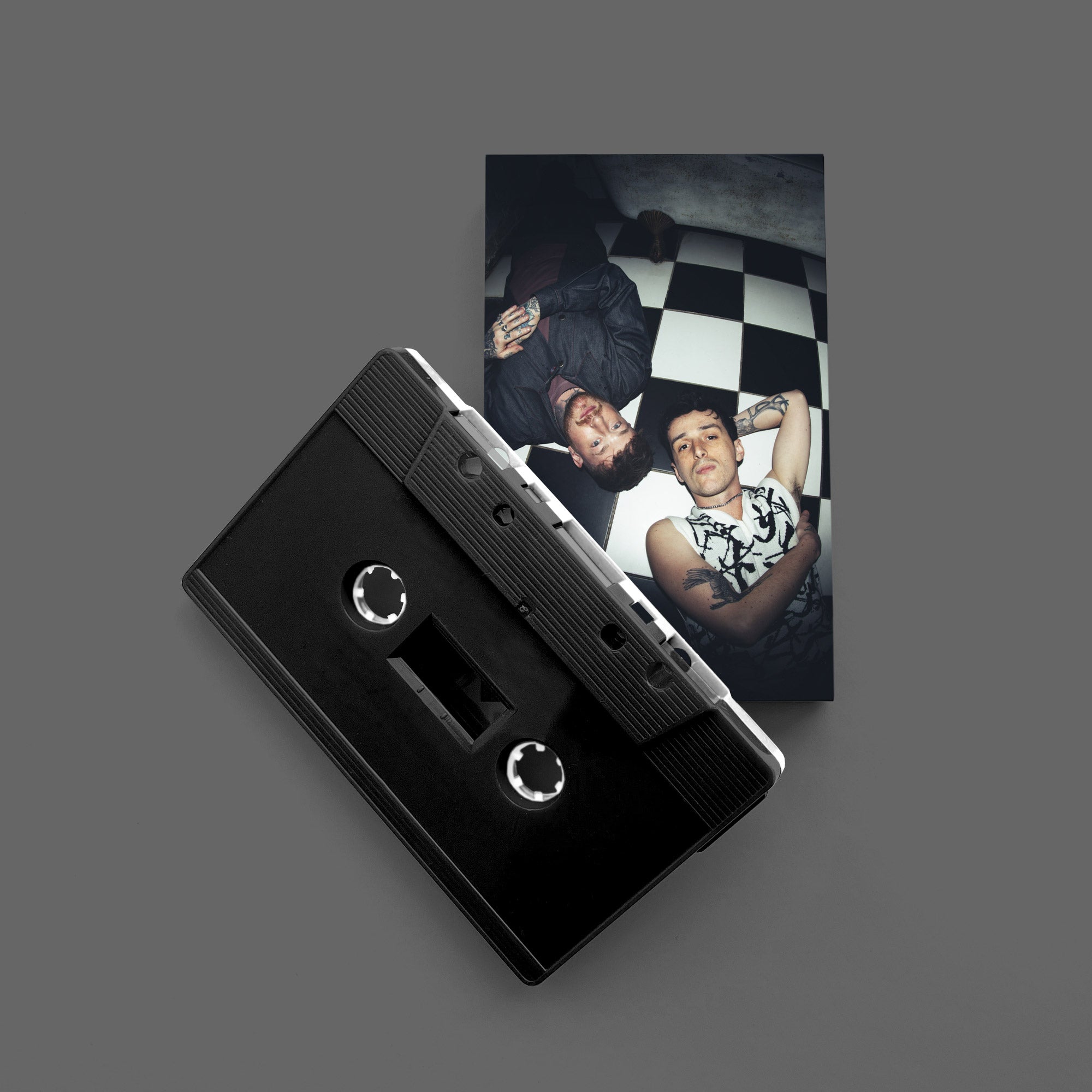 We're Never Getting Out: Dual Black and White Shell Cassette